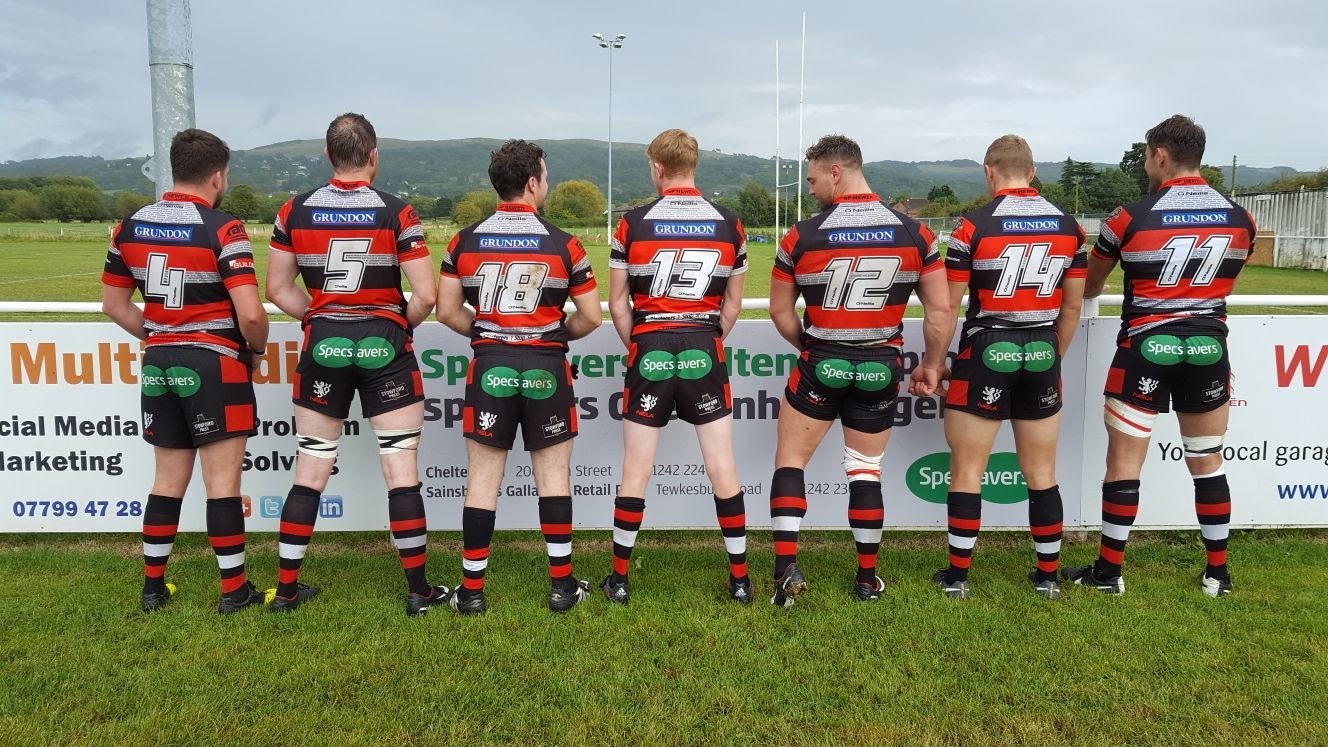Sponsorship Rugby players standing with their backs to the camera.